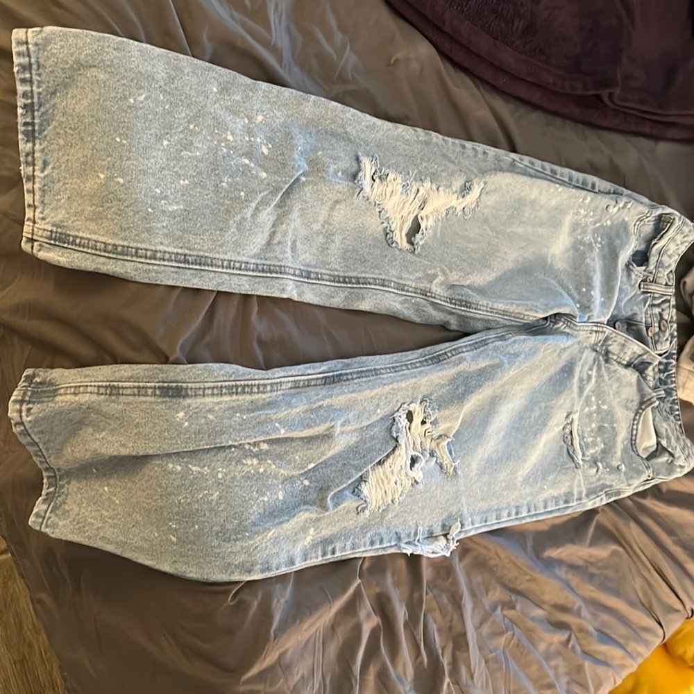 Distressed, paint splatter blue jeans